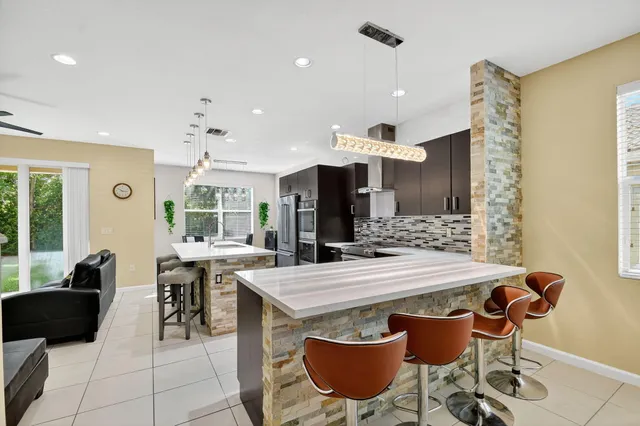 a view of a dining room with furniture and a large window