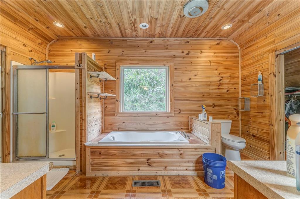 519 East Valley Road Northeast Rydal, GA 30171 - Photo 13 of 28 a bathroom with a bathtub and shower
