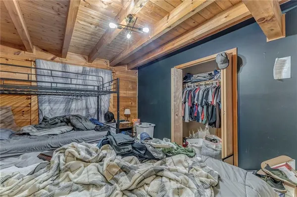 a bedroom with furniture and a window