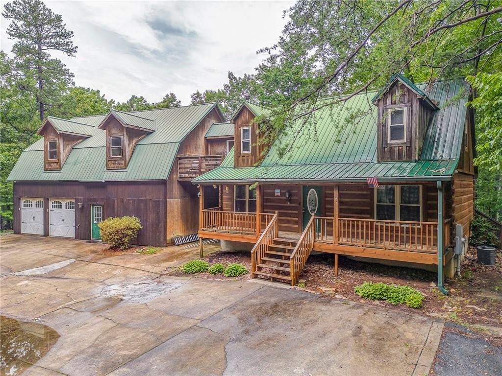 519 East Valley Road Northeast Rydal, GA 30171 - Photo 2 of 28 a front view of a house with a yard and a garage
