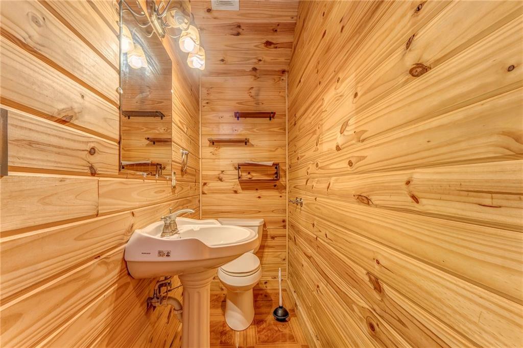 519 East Valley Road Northeast Rydal, GA 30171 - Photo 21 of 28 a bathroom with a sink and a mirror