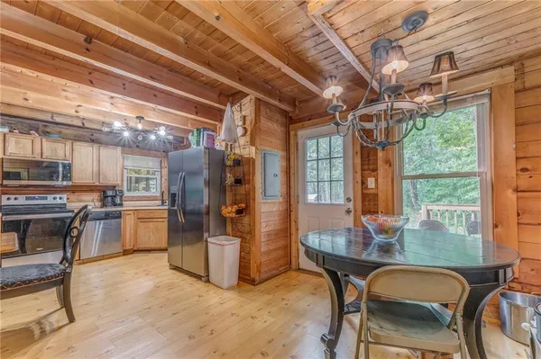 a dining room with furniture and window