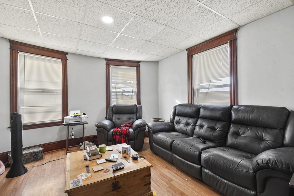23 King Philip Road Worcester, MA 01606 - Photo 29 of 42 a living room with furniture and a window