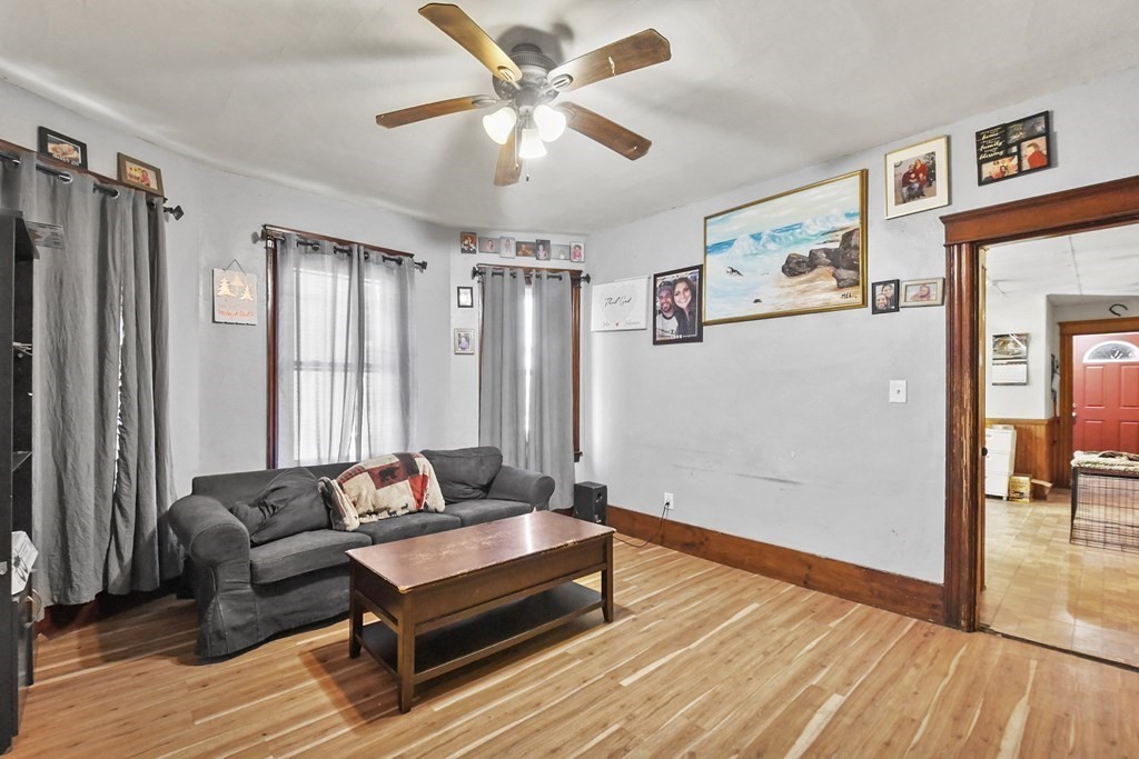23 King Philip Road Worcester, MA 01606 - Photo 7 of 42 a living room with furniture a ceiling fan and a rug