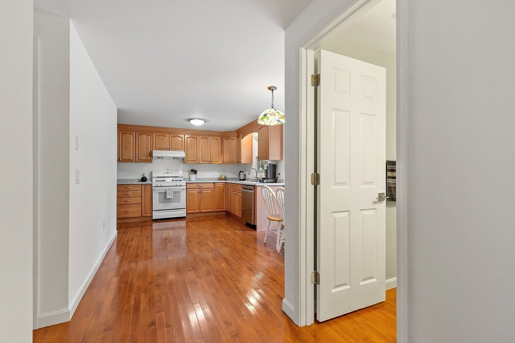 170 Mill Road, Unit 170 Chelmsford, MA 01824 - Photo 14 of 42 a view of kitchen with wooden floor