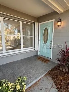 a front view of a house with a large window
