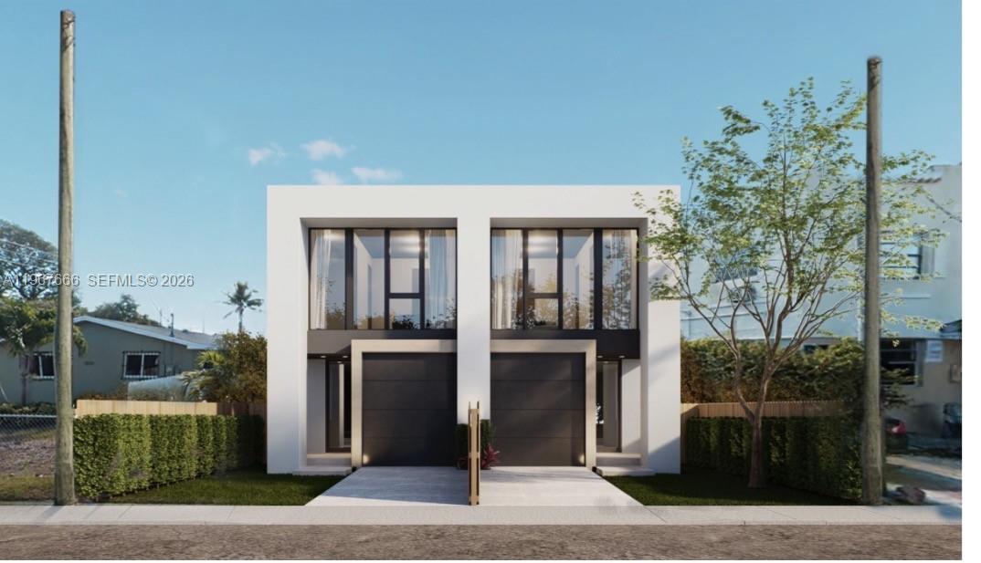 1810 Northwest 46th Street Miami, FL 33142 - Photo 1 of 4 a front view of a house with a garden