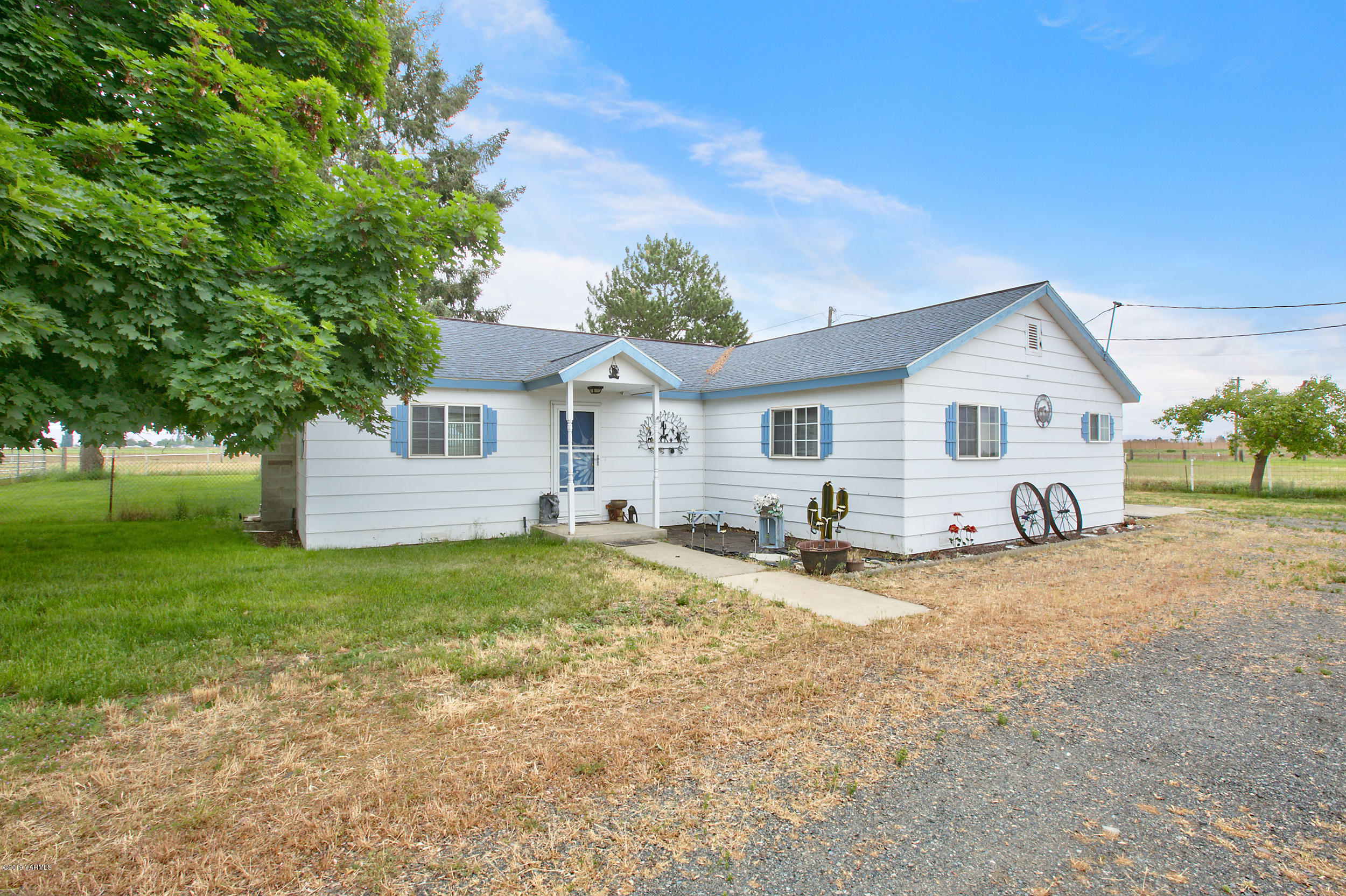6235 Lateral A Road Wapato, WA 98951 - Photo 2 of 30 a view of a house with backyard and trees