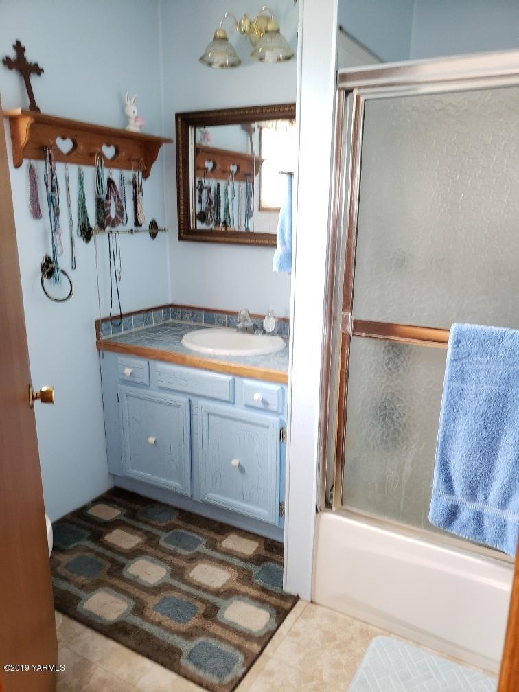 6235 Lateral A Road Wapato, WA 98951 - Photo 27 of 30 a bathroom with a bathtub and a shower