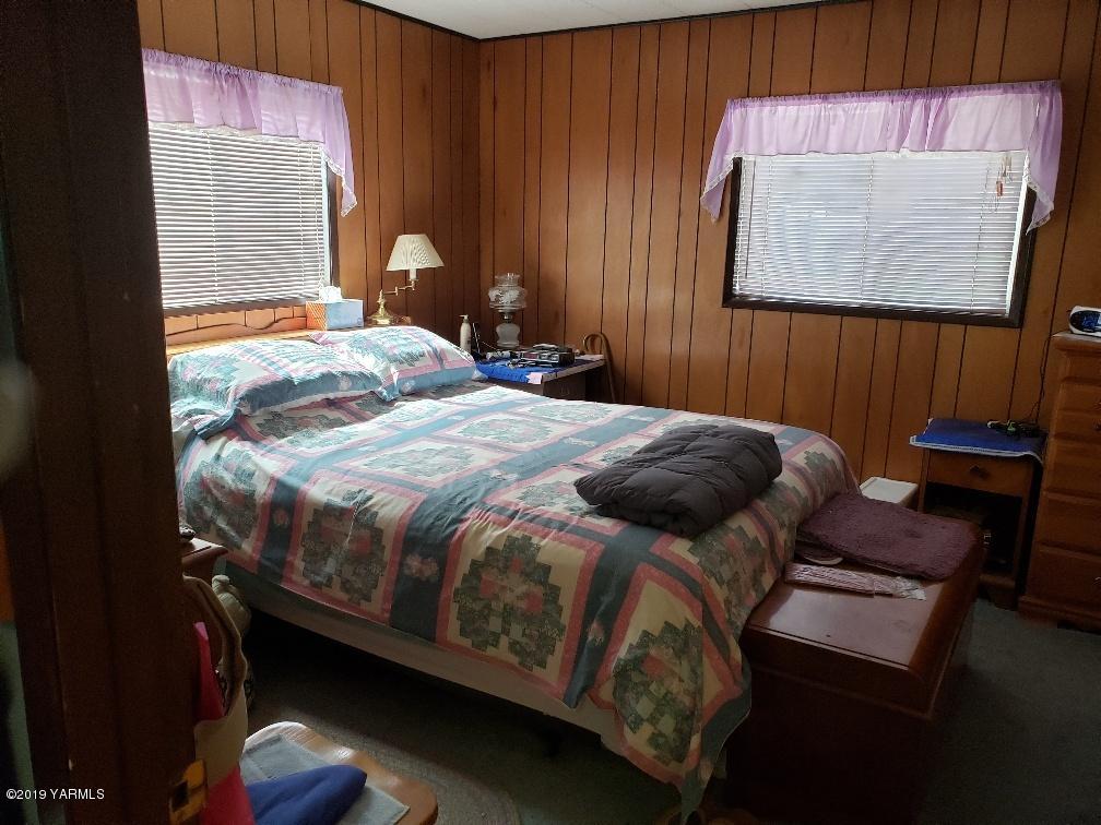 6235 Lateral A Road Wapato, WA 98951 - Photo 28 of 30 a bedroom with a bed and wooden floor
