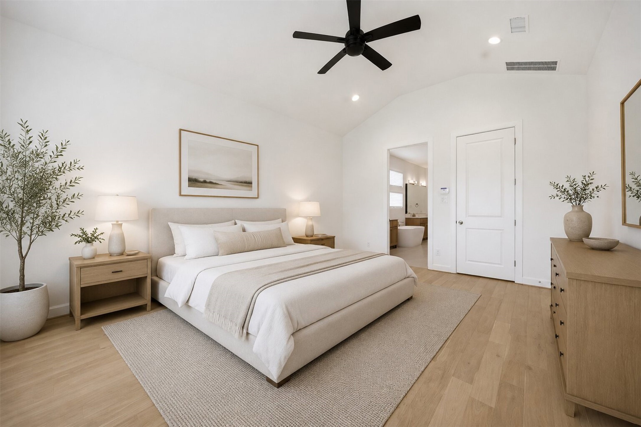 416 Venado View Court Conroe, TX 77304 - Photo 15 of 34 **Virtually Staged** Spacious and serene primary suite featuring soaring ceilings, abundant natural light, warm wood flooring, and a spa-inspired atmosphere designed for comfort and relaxation.