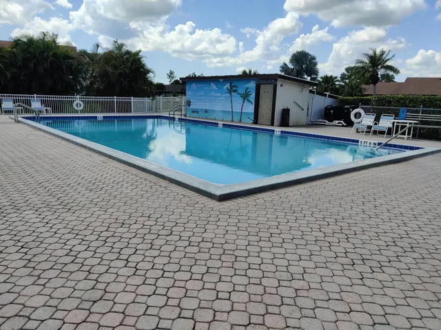 a view of a swimming pool with a chair