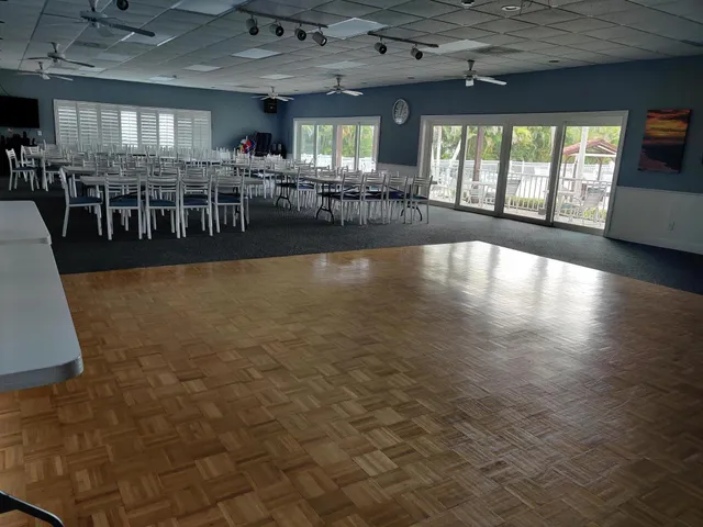 a view of a swimming pool with outdoor seating