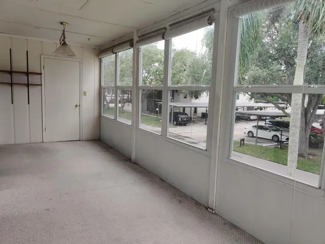 a view of a room with a large window