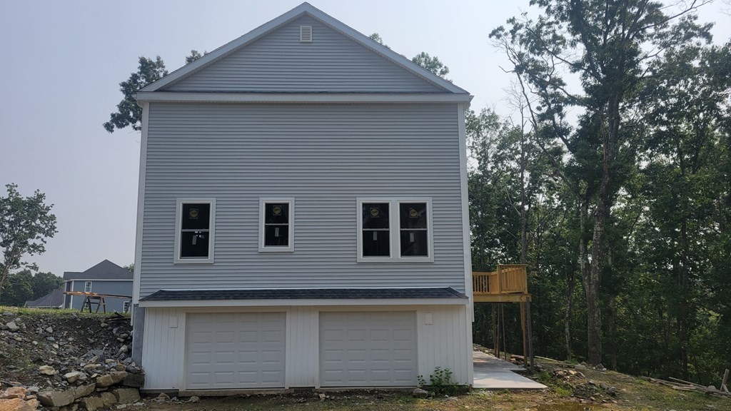 32 Brookside Avenue Webster, MA 01570 - Photo 4 of 6 a front view of a house with a yard