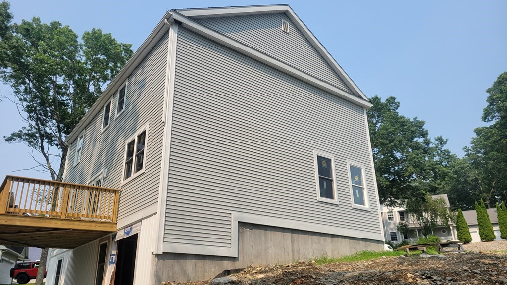 32 Brookside Avenue Webster, MA 01570 - Photo 6 of 6 a view of a house with a balcony