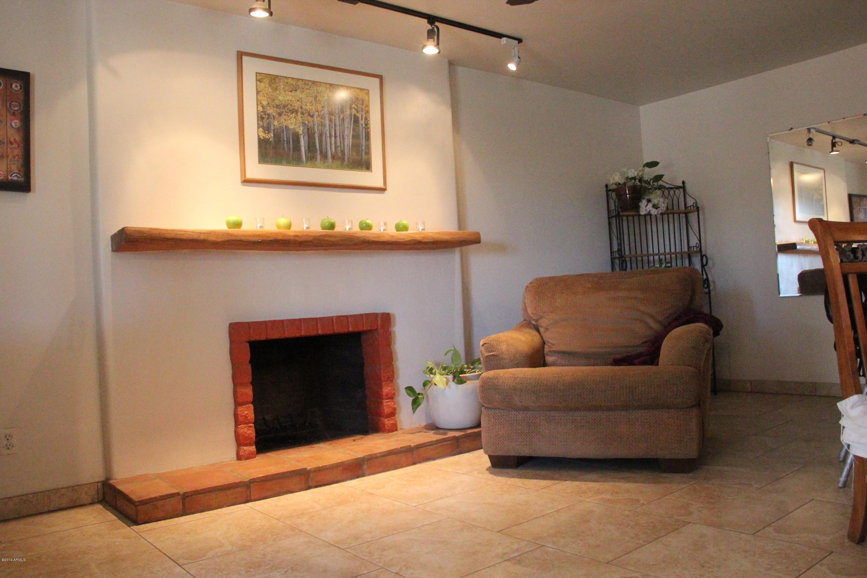 3915 West Calavar Road Phoenix, AZ 85053 - Photo 21 of 29 21-Family Room Fireplace