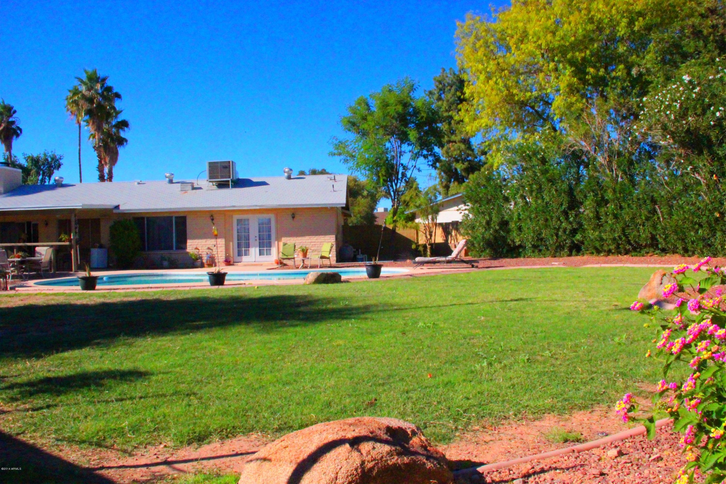 3915 West Calavar Road Phoenix, AZ 85053 - Photo 26 of 29 26-Back Yard-Mature Landscaping