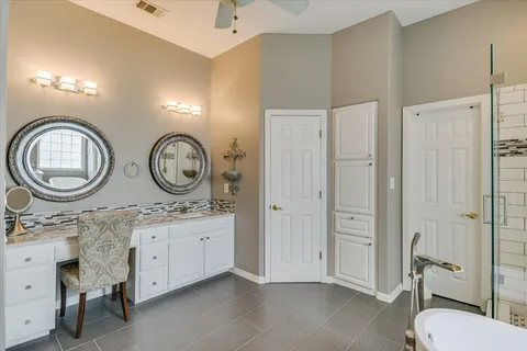 a bathroom with a toilet a sink and a mirror