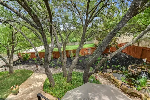 a backyard of a house with lots of green space