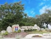a view of a wooden house with a yard
