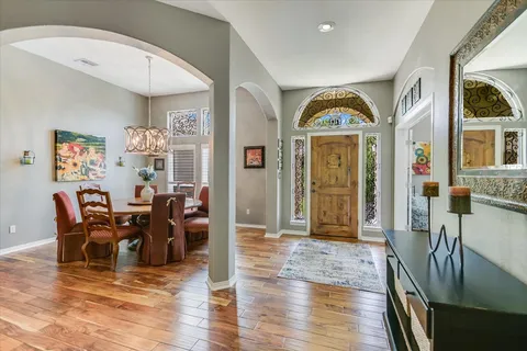 a view of a livingroom with furniture window and wooden floor