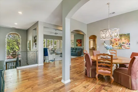 a view of a dining room with furniture and wooden floor