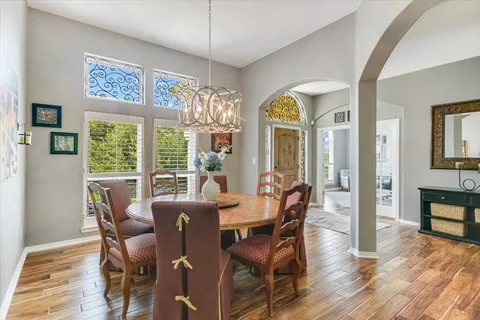a view of a dining room with furniture window and wooden floor