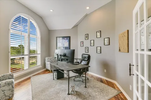 a workspace with furniture and a window