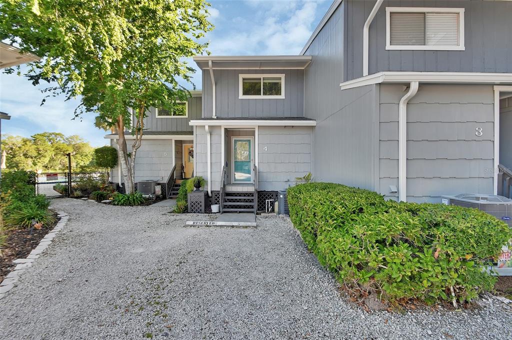 2329 River Ridge Road, Unit 4 DeLand, FL 32720 - Photo 1 of 23 a view of a house with a garden