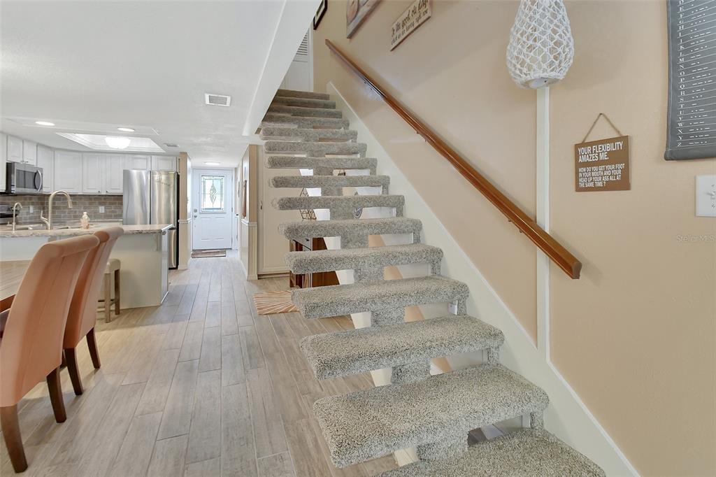 2329 River Ridge Road, Unit 4 DeLand, FL 32720 - Photo 12 of 23 a view of entryway and hall with wooden floor