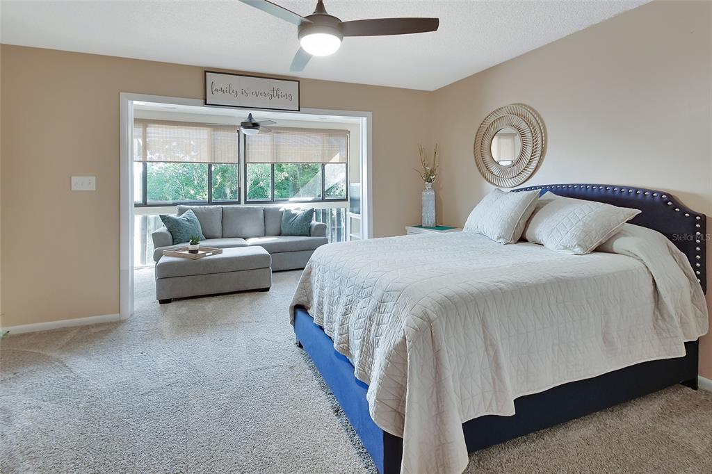 2329 River Ridge Road, Unit 4 DeLand, FL 32720 - Photo 17 of 23 a bedroom with a bed and a large window