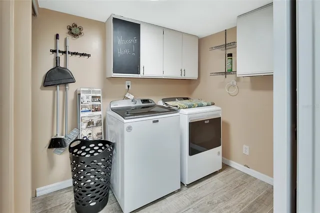 a utility room with cabinets