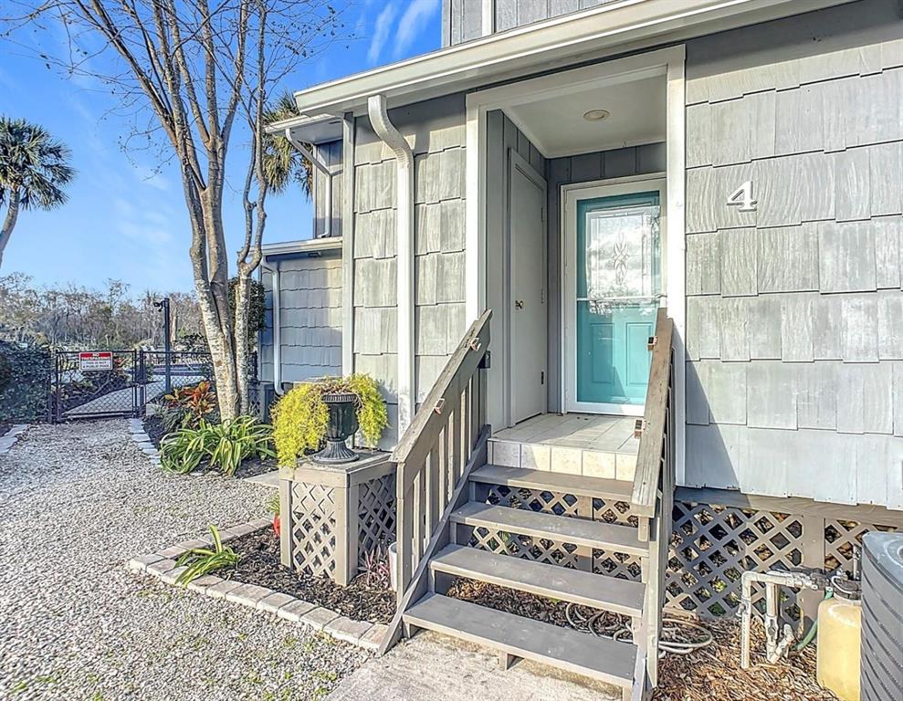 2329 River Ridge Road, Unit 4 DeLand, FL 32720 - Photo 2 of 23 a front view of a house with a fountain