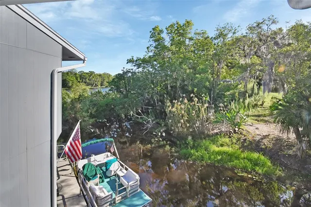 a backyard of a house with outdoor seating