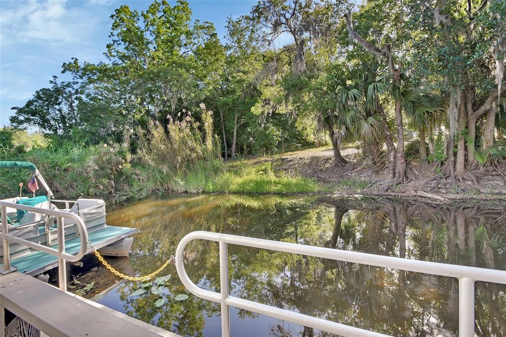2329 River Ridge Road, Unit 4 DeLand, FL 32720 - Photo 22 of 23 a view of yard with green space and seating area