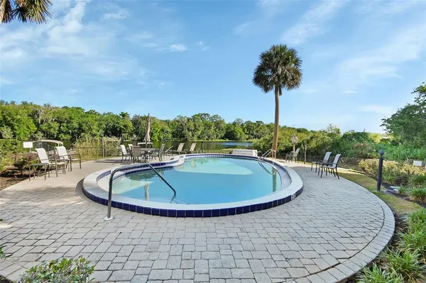 a view of a swimming pool with a patio
