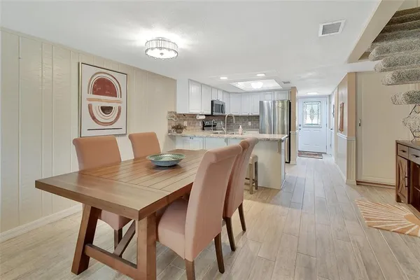 a view of kitchen and dining area with furniture