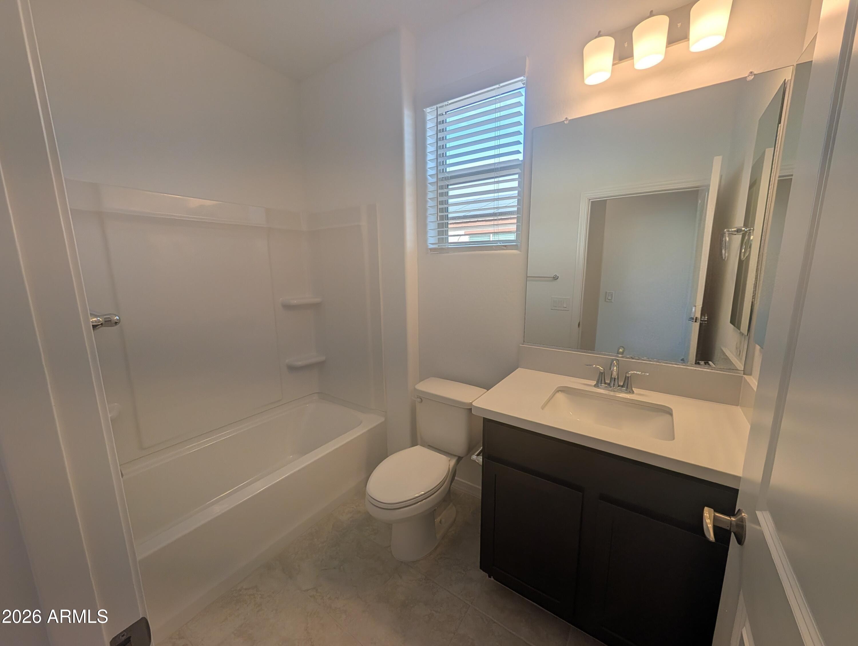 16340 South 182nd Drive Goodyear, AZ 85338 - Photo 10 of 38 a bathroom with a sink a toilet and shower