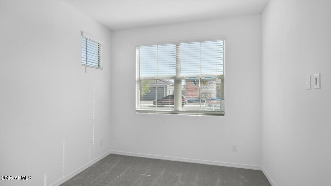 16340 South 182nd Drive Goodyear, AZ 85338 - Photo 16 of 38 a view of an empty room with a window