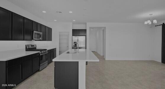 16340 South 182nd Drive Goodyear, AZ 85338 - Photo 29 of 38 a kitchen with stainless steel appliances a sink stove and refrigerator