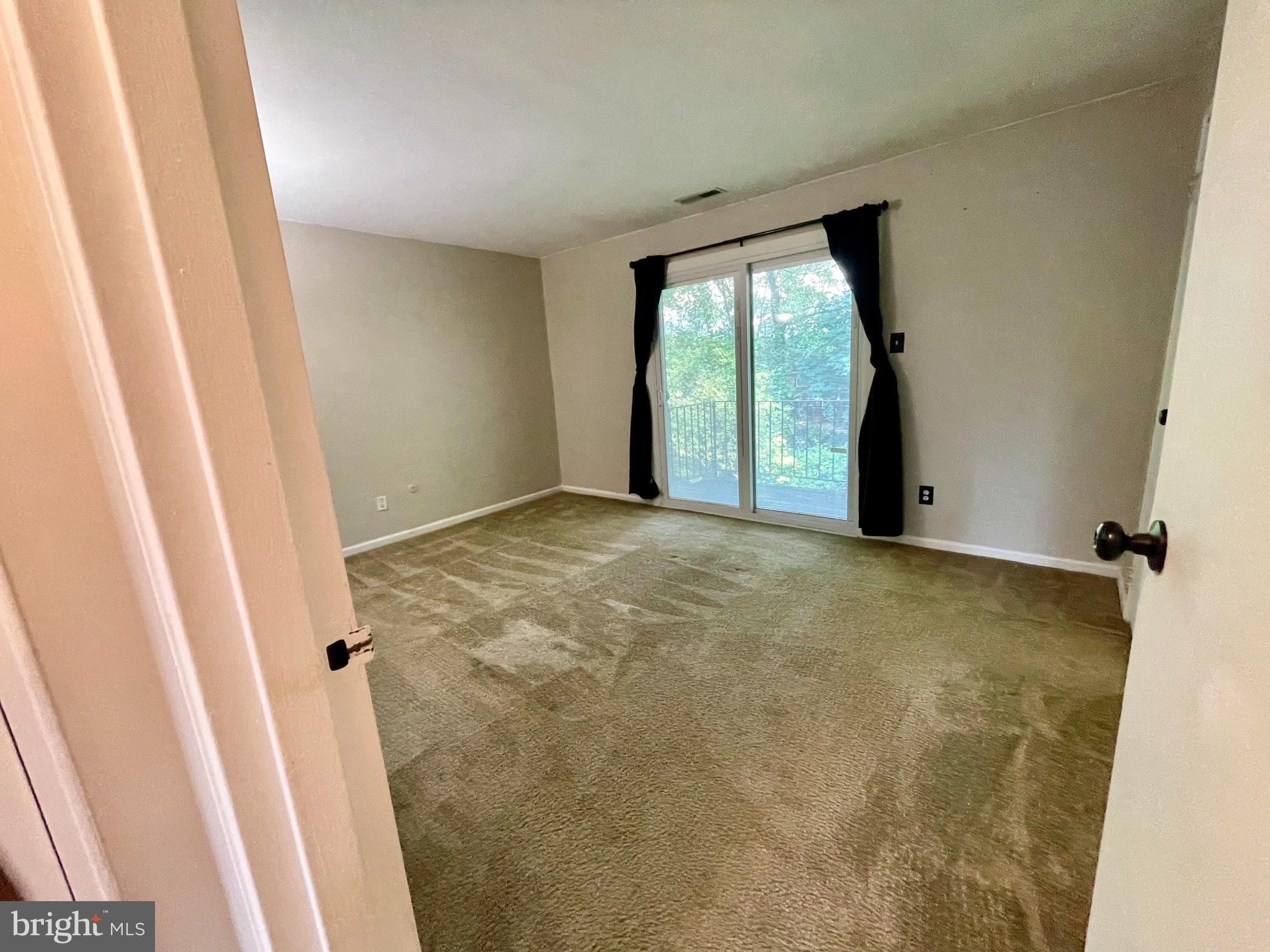 810 North Forklanding Road, Unit 116 Maple Shade, NJ 08052 - Photo 8 of 11 a view of an empty room with a window