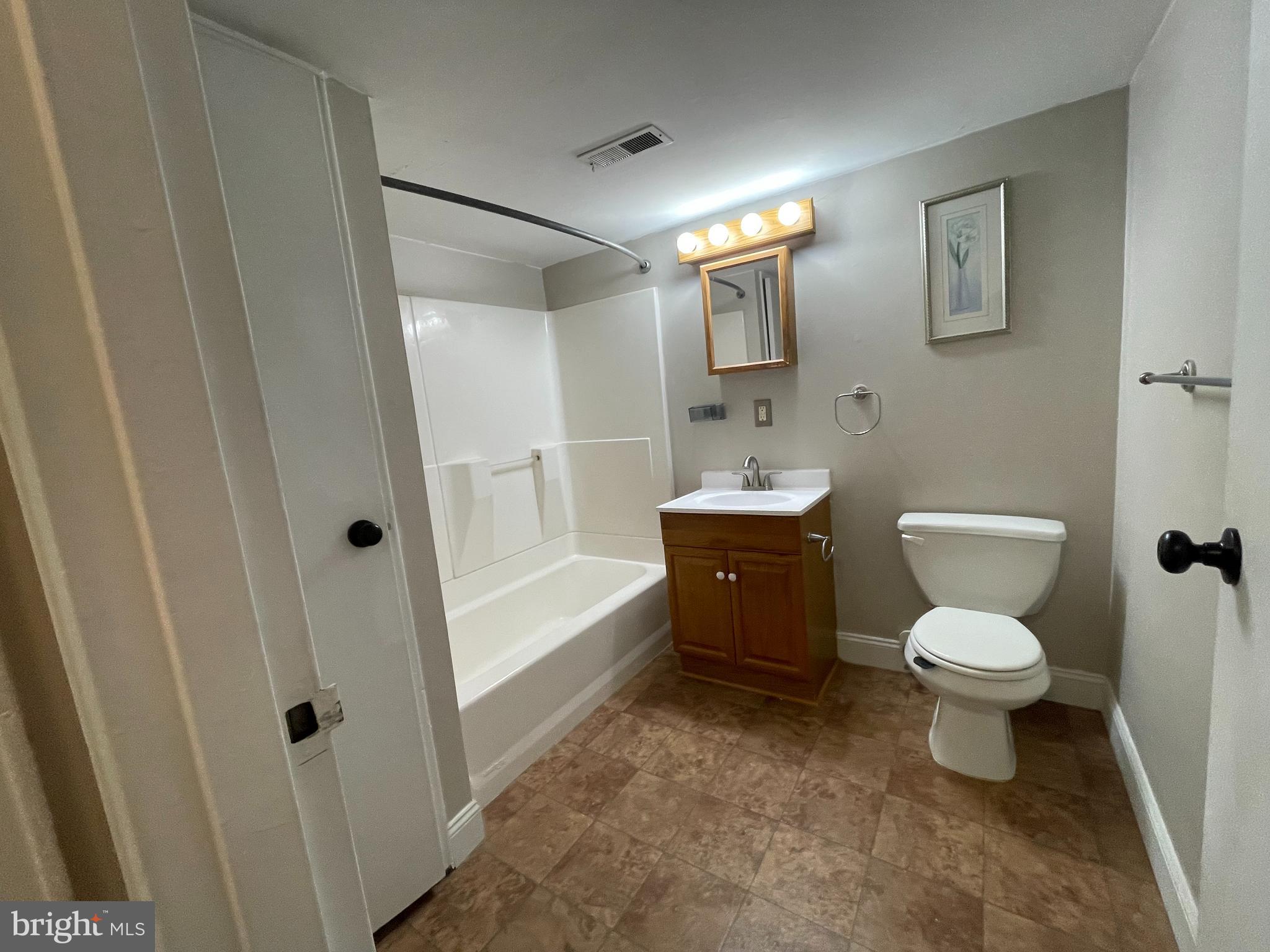810 North Forklanding Road, Unit 116 Maple Shade, NJ 08052 - Photo 9 of 11 a bathroom with a toilet a sink and bathtub
