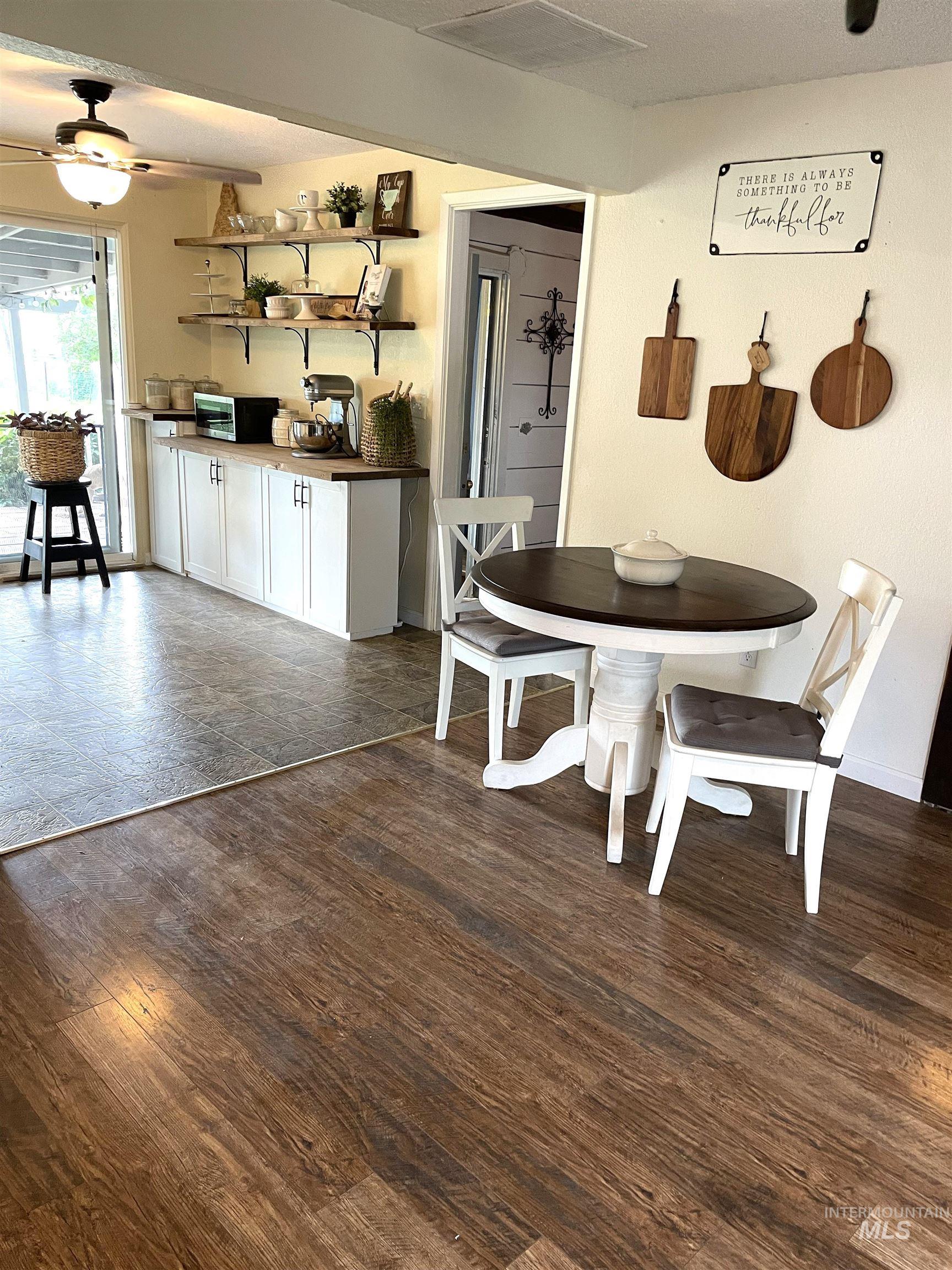 12733 South Five Mile Road Kuna, ID 83634 - Photo 5 of 21 Dining area with dark wood finished floors and ceiling fan