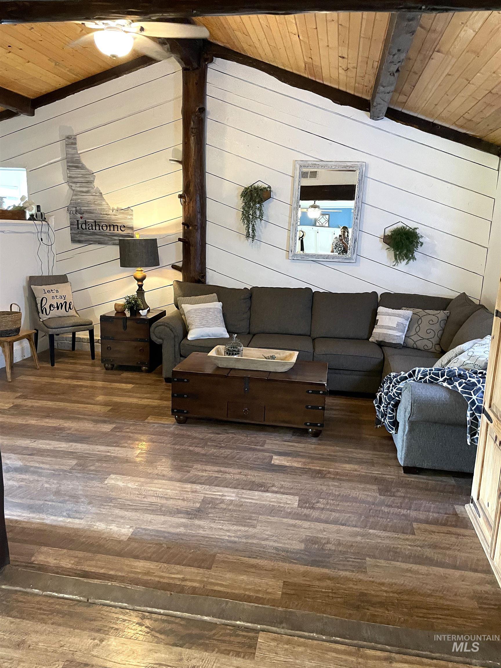 12733 South Five Mile Road Kuna, ID 83634 - Photo 8 of 21 Living area with wooden walls, wooden ceiling, and wood-type flooring