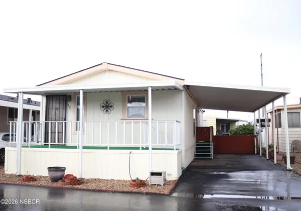 a front view of a house with garage