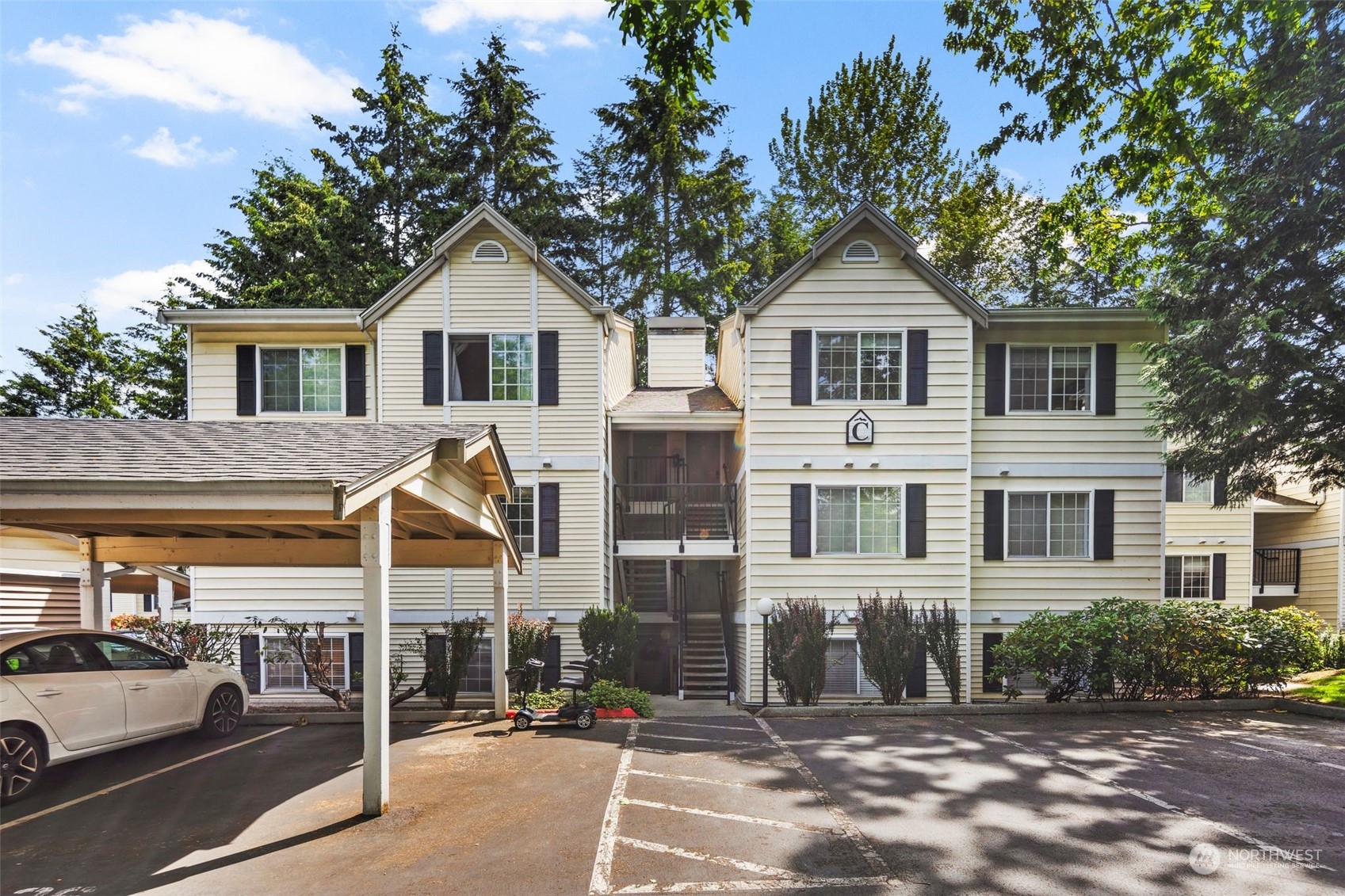 580 Front Street South, Unit C113 Issaquah, WA 98027 - Photo 1 of 31 a front view of a house with yard