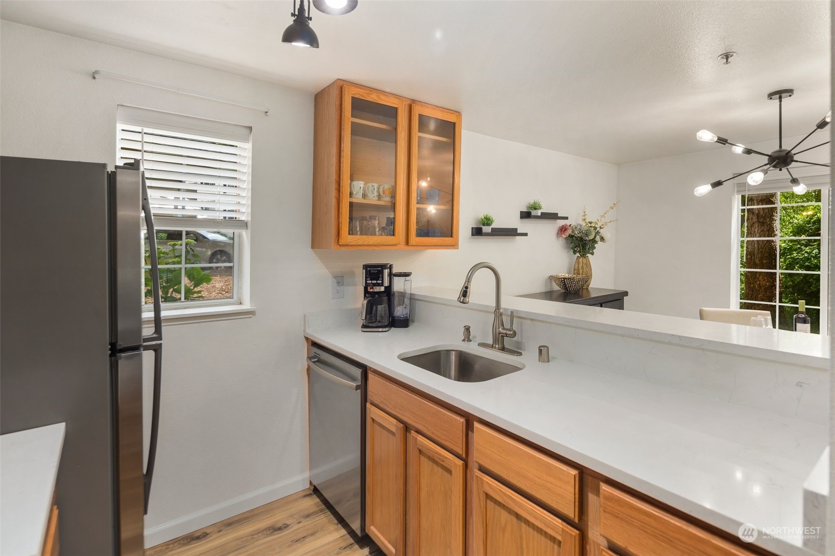 580 Front Street South, Unit C113 Issaquah, WA 98027 - Photo 14 of 31 a kitchen with a sink and a refrigerator