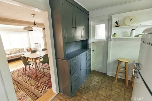 a kitchen with a table and chairs