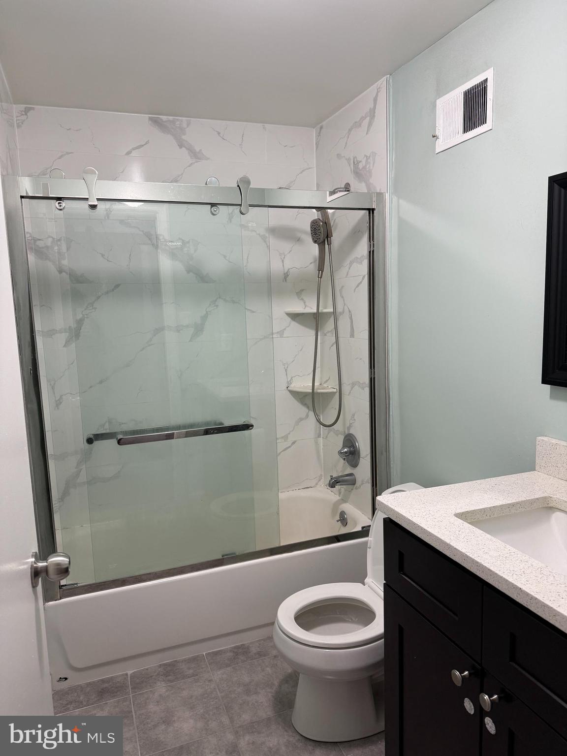 1326 South Colorado Street Philadelphia, PA 19146 - Photo 8 of 12 a bathroom with a granite countertop sink toilet and shower